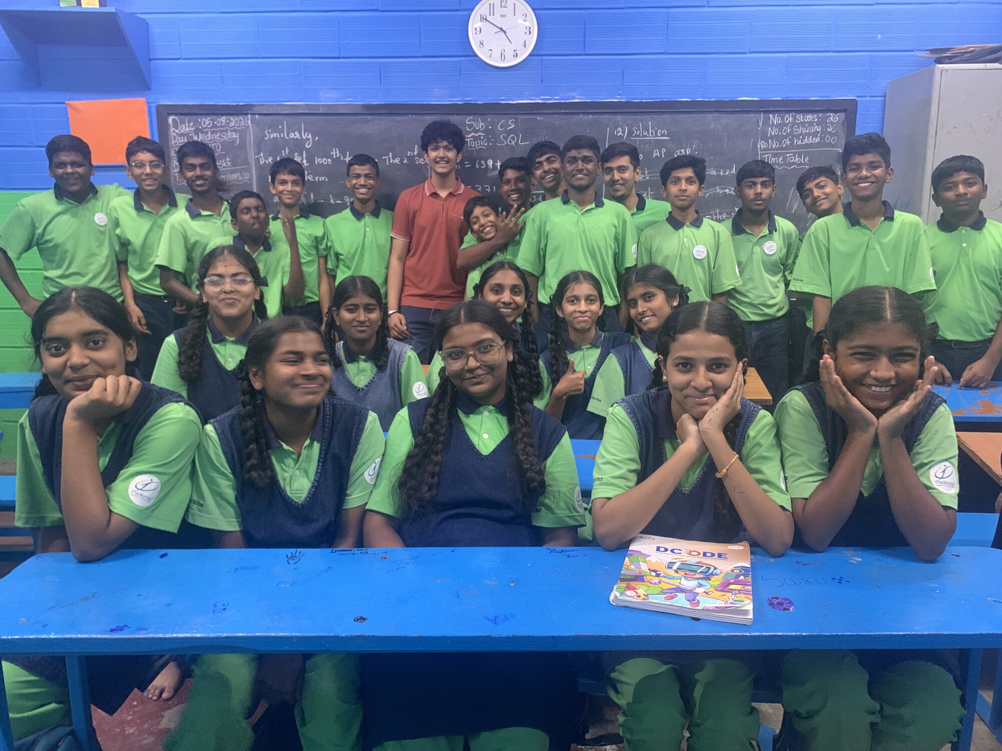 A Parikrma class posing with WIEMO facilitators after a session