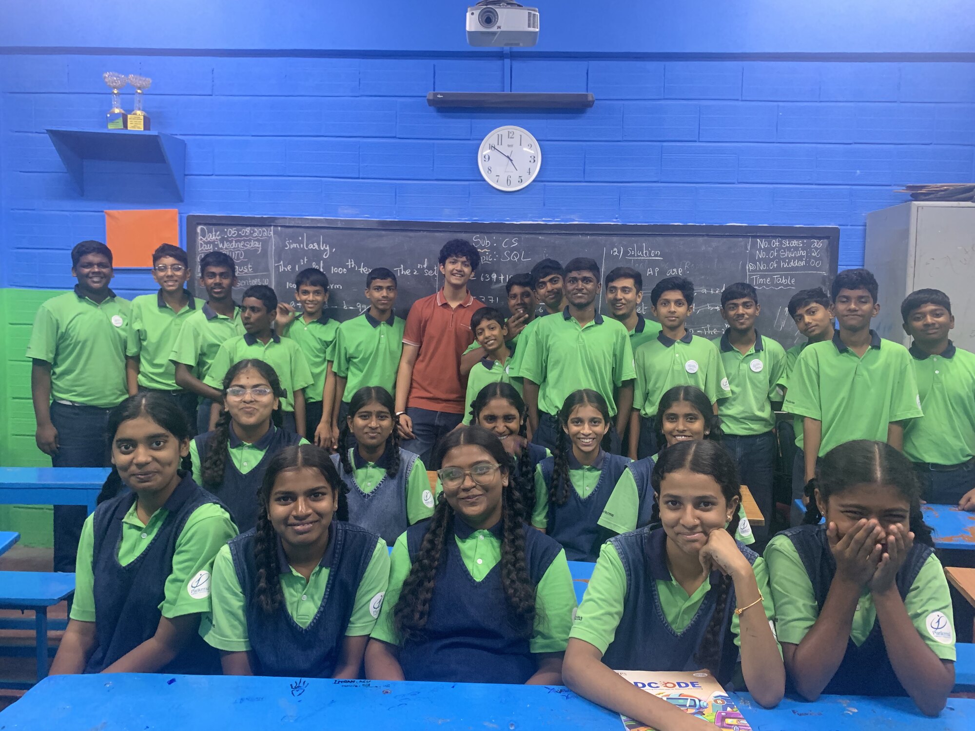 Students and facilitators smiling together at the end of a session