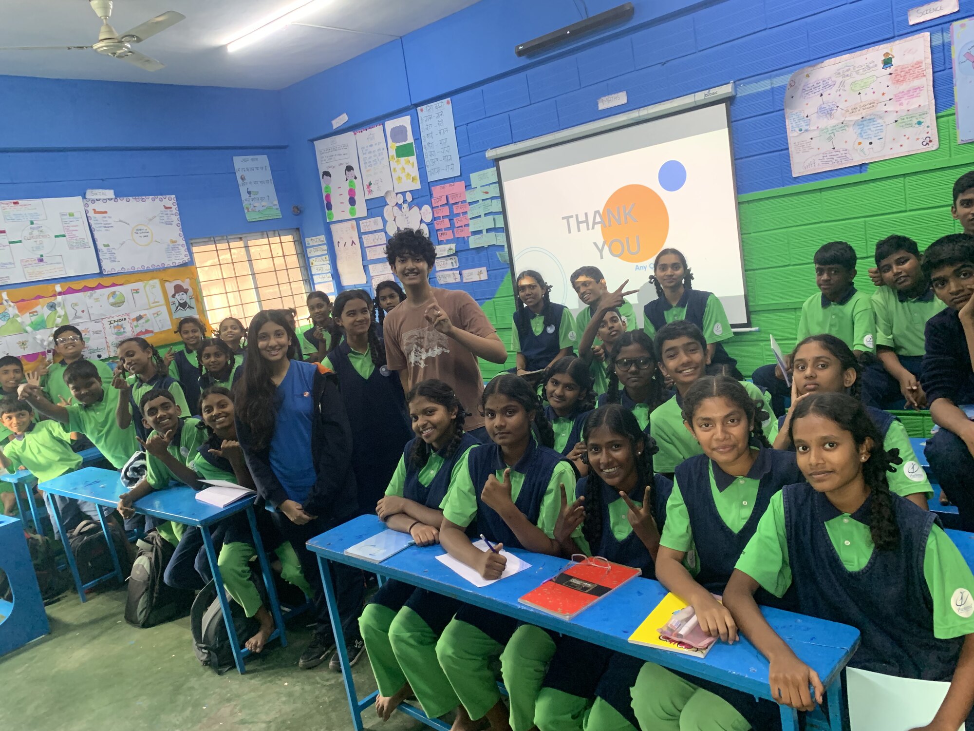 A Parikrma classroom gathered around WIEMO facilitators